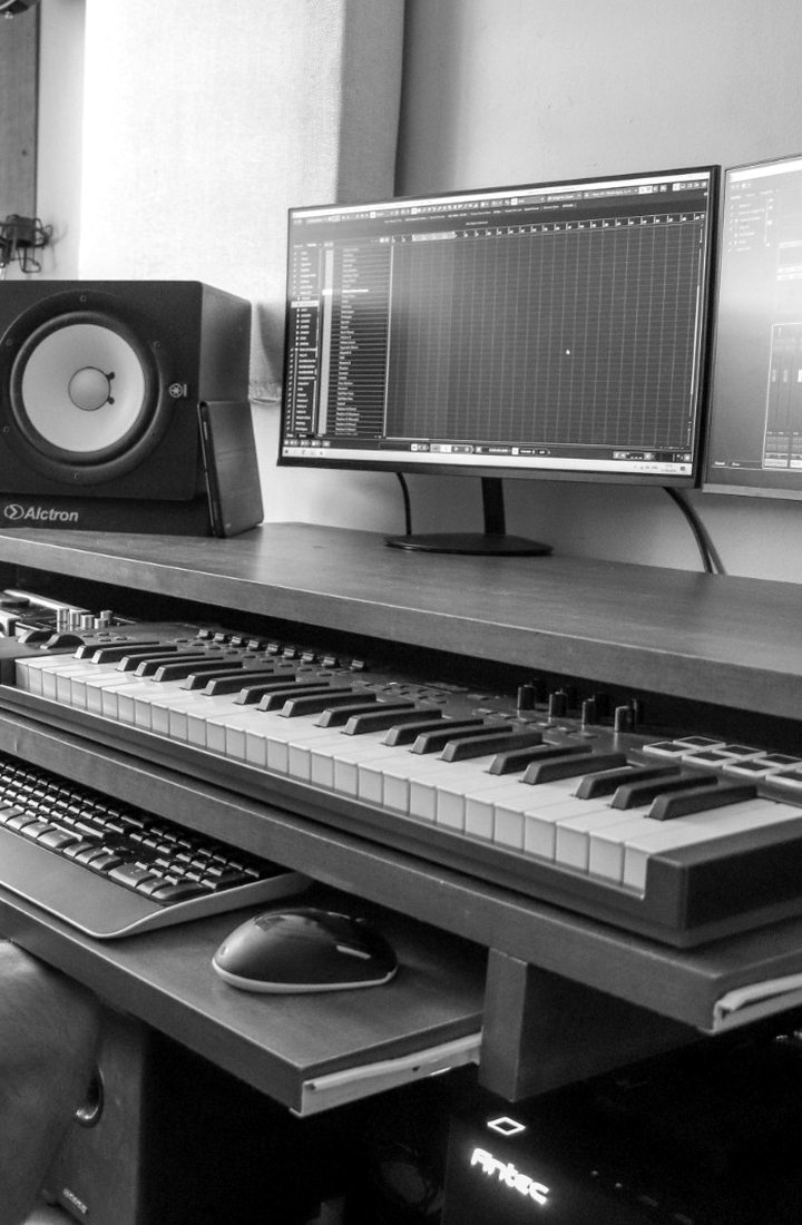 Val-U-Music studio desk with monitors and keyboard